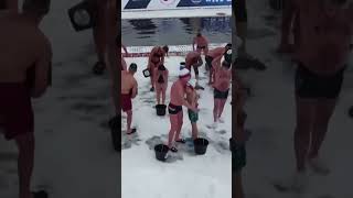 Russian winter swimmers pour themselves with icy waters for heat-up