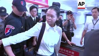 Wife of Taiwanese activist departs for China trial