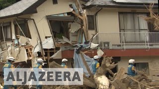 Japan floods: PM Shinzo Abe visits worst affected areas