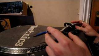 adjusting the weight on a turntables tone-arm