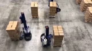 Multiple Robot S6 portable stretch wrappers wrapping loads in warehouse - Robopac USA