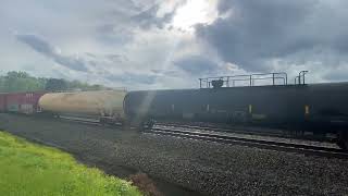 NS 4468 leads NS 168 with 2 hight and wides with 2 derailed grain cars