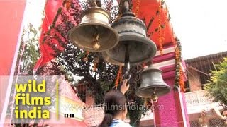 Hindu devotees ringing temple bells in Nainital