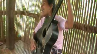 Blind filipina lady plays guitar