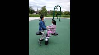 James Cheng and Jacqueline Cheng at park children playground seesaw