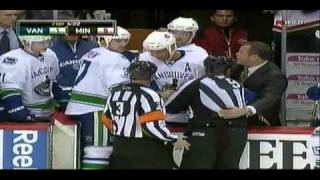 Canucks' Rypien trin to attack a Wild fan