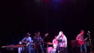 Brandon Bihn and other School of Rock Mason members perform \