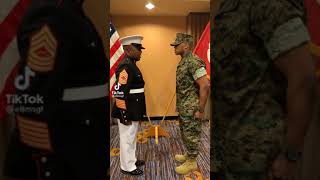 Marine father gives son his first salute