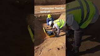 Conducting a compaction test (FDT) beneath the building foundation prior to pouring lean concrete.