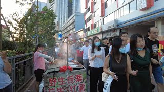 Shenzhen, China, Huawei employees, young people off-get off work scene crowded with roads