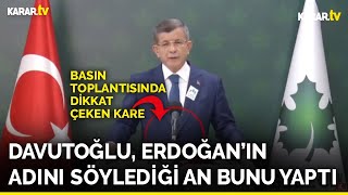 Davutoğlu, Erdoğan'ın adını andığı an ceketinin önünü açtı