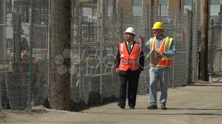 Construction Worker And Business Man Visiting Construction Site. Stock Footage