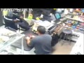 New York shopkeeper chases armed robber with machete - CCTV video