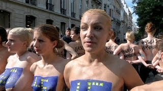 Femen hold topless protest outside National Front campaign launch