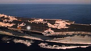 USS Kitty Hawk (CV-63) and USS Preble (DLG-15) underway in the Pacific Ocean. HD Stock Footage