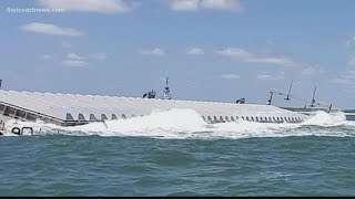 Beached barge loaded with hazardous waste