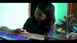 Woman makes a Silk wrap-around skirt - Phige Phanek in Manipur, India