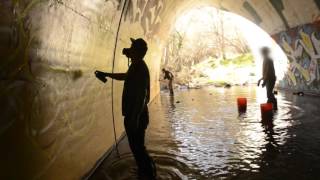 ArtPrimo.com Presents:  QUES, BEGR, BLIEF painting in a flooded tunnel