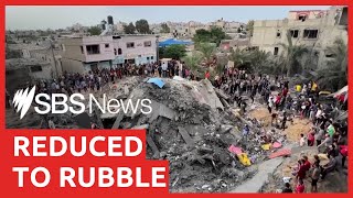 Palestinians search through the rubble of flattened buildings in Gaza | SBS News