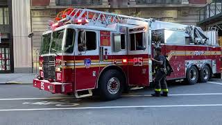 FDNY LADDER 25 RESPONDING FROM QUARTERS ON WEST 77TH STREET ON WEST SIDE OF MANHATTAN, NEW YORK CITY