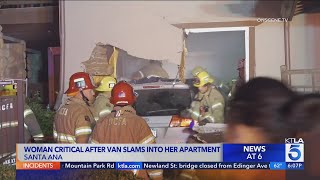 Woman in critical condition after van slams into apartment