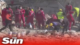 Rescuers pull survivors from earthquake wreckage as death toll reaches over 20k