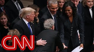Michelle Obama, George W. Bush share warm moment at funeral