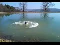 christian jumps his bike into the pond.