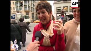 A nontraditional window display is drawing crowds in NYC among traditional Fifth Avenue holiday wind