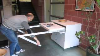 Folding away a pull out kitchen table frame