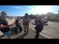 Motorcycle cop pulls up on the scene