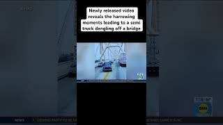 Newly released video reveals the harrowing moments leading to a semi truck dangling off a bridge!