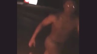 Naked black man chasing car