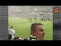 melbourne victory fans storm the pitch in protest to the a league moving grand finals to sydney.