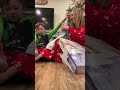 opening an early gift from his sister 🎄