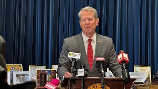 Georgia Gov. Kemp pauses new spending, gets partisan pushback