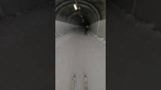skiing on pass road & through car tunnel