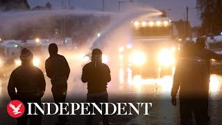 Police blast rioters with water cannon as violence flares in Northern Ireland