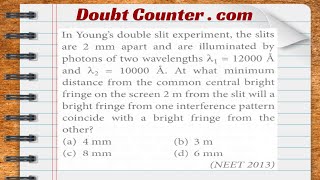 In Young's double slit experiment, the slits are 2 mm apart and are illuminated by photons of two