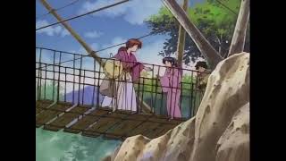 Kenshin helps Kaoru cross the bridge