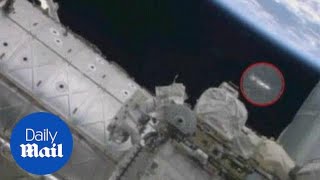 UFO spotted above astronaut as he repairs ISS - Daily Mail