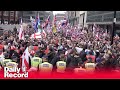 Tommy Robinson protest: Thousands gather in central London as activist remains in custody