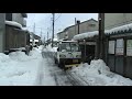 除雪する軽四トラ　ダンパー