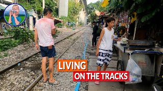 Active train tracks are a vibrant part of life in Bangkok