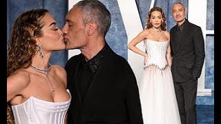 Rita Ora and Taika Waititi share a loving kiss as they dress to the nines at 2023 Vanity Fair party