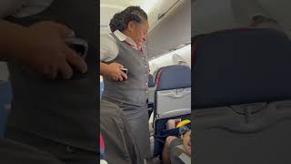 Delta Airlines Flight Attendant with her comfortable shoes@MARKPERRY-7412