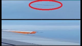 Passenger on an airplane has filmed a strange object hovering in the sky from the window. UFO