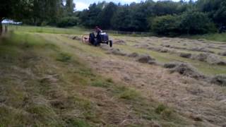 Grey Fergie Turning Hay