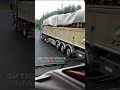 a vintage iveco truck with a loaded trailer makes a loud sound while overtaking