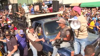 Venezuelan opposition leader Machado exits rally on motorcycle before confusing arrest claims emerge